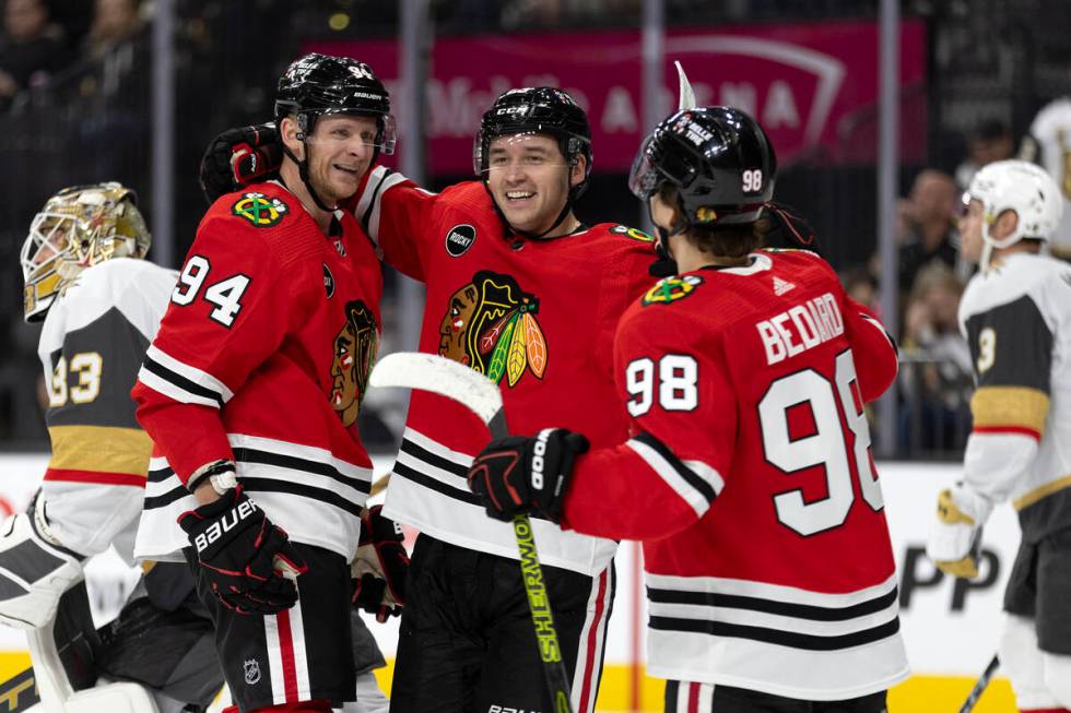 Blackhawks right wing Corey Perry (94), center Philipp Kurashev (23) and center Connor Bedard ( ...