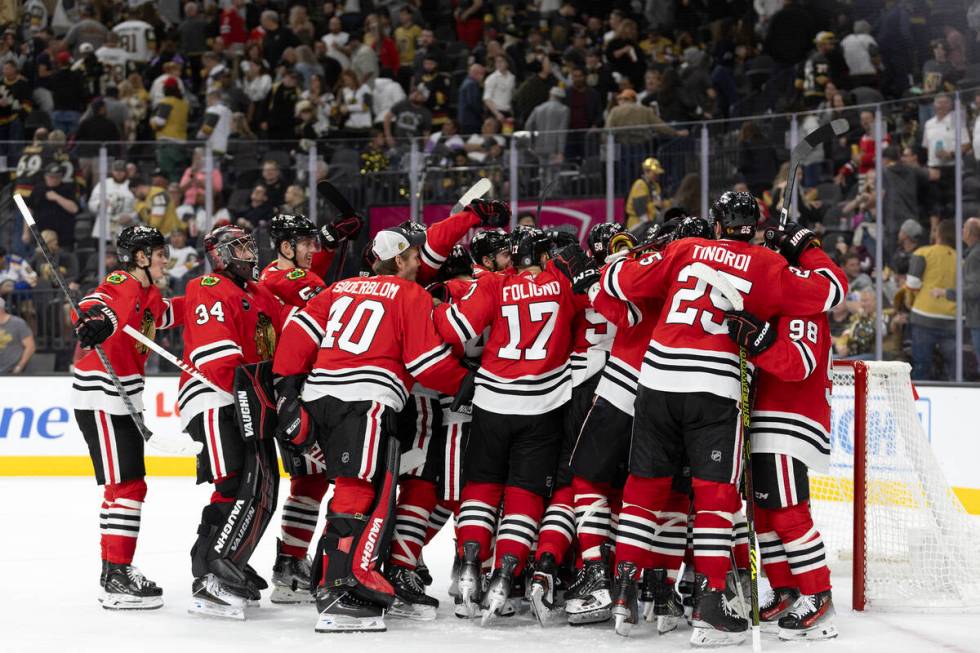 The Blackhawks celebrate their overtime win in an NHL hockey game against the Golden Knights at ...