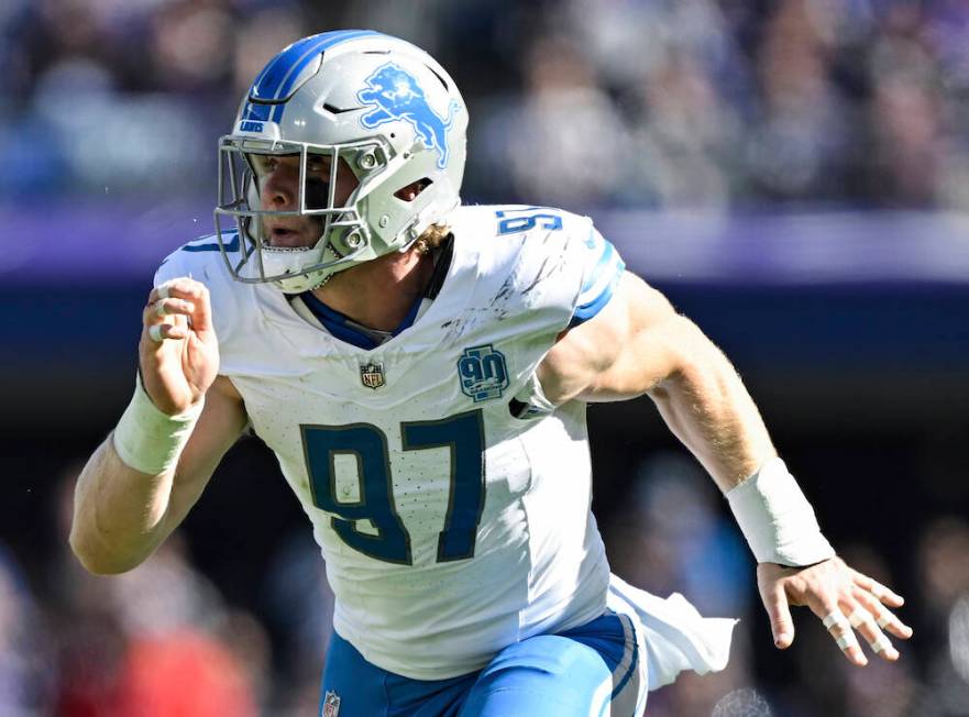 Detroit Lions defensive end Aidan Hutchinson (97) in action during the first half of an NFL foo ...