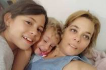 Dafna Elyakim, 15 and Ella Elyakim, 8, with their mother, Maayan Ziv. Dafna and Ella have been ...