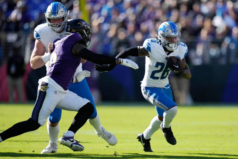 Detroit Lions running back Jahmyr Gibbs (26) rushes during the second half of an NFL football g ...