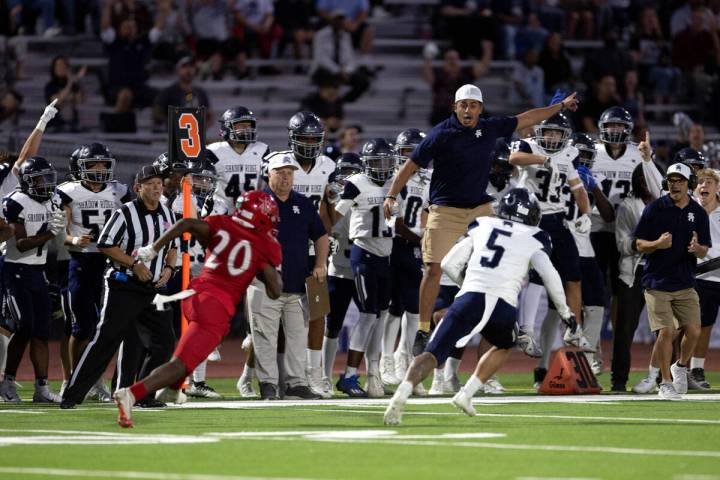 Shadow Ridge cheers on their Keau Hadley Jr. (5) while he pivots with his interception intended ...