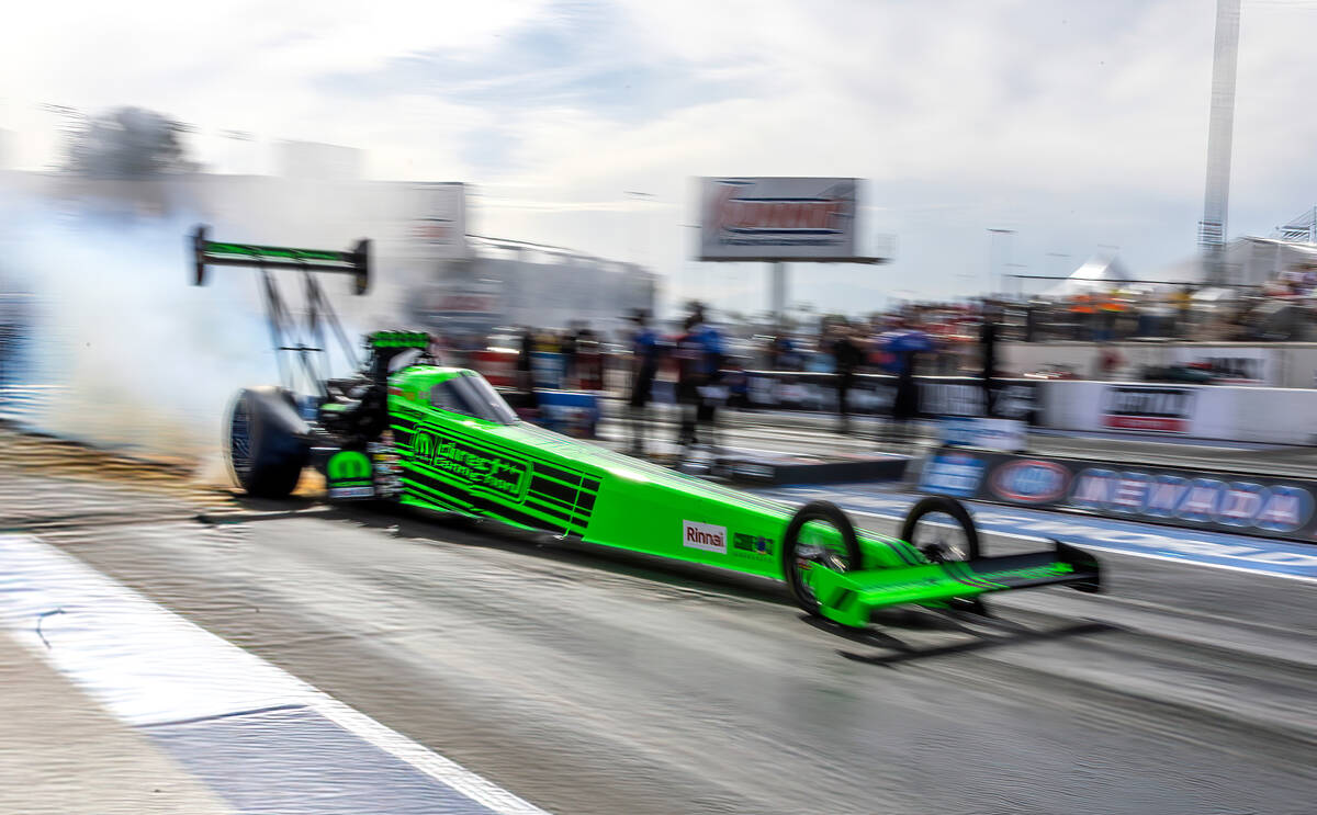 Top Fuel racer Leah Pruett leaves the start during a qualifying session in the NHRA Nevada Nati ...