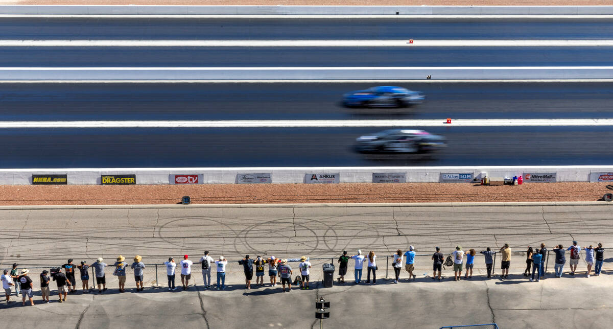 Fans watch during a qualifying session in the NHRA Nevada Nationals at The Strip at Las Vegas M ...