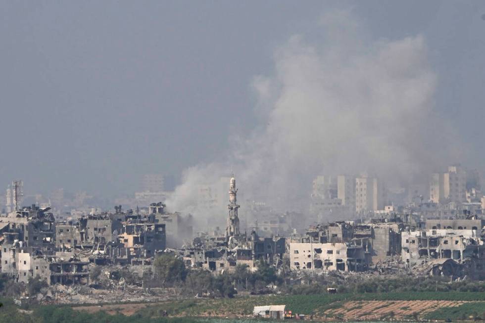 Smoke rises following an Israeli airstrike in the Gaza Strip, as seen from southern Israel, Sat ...