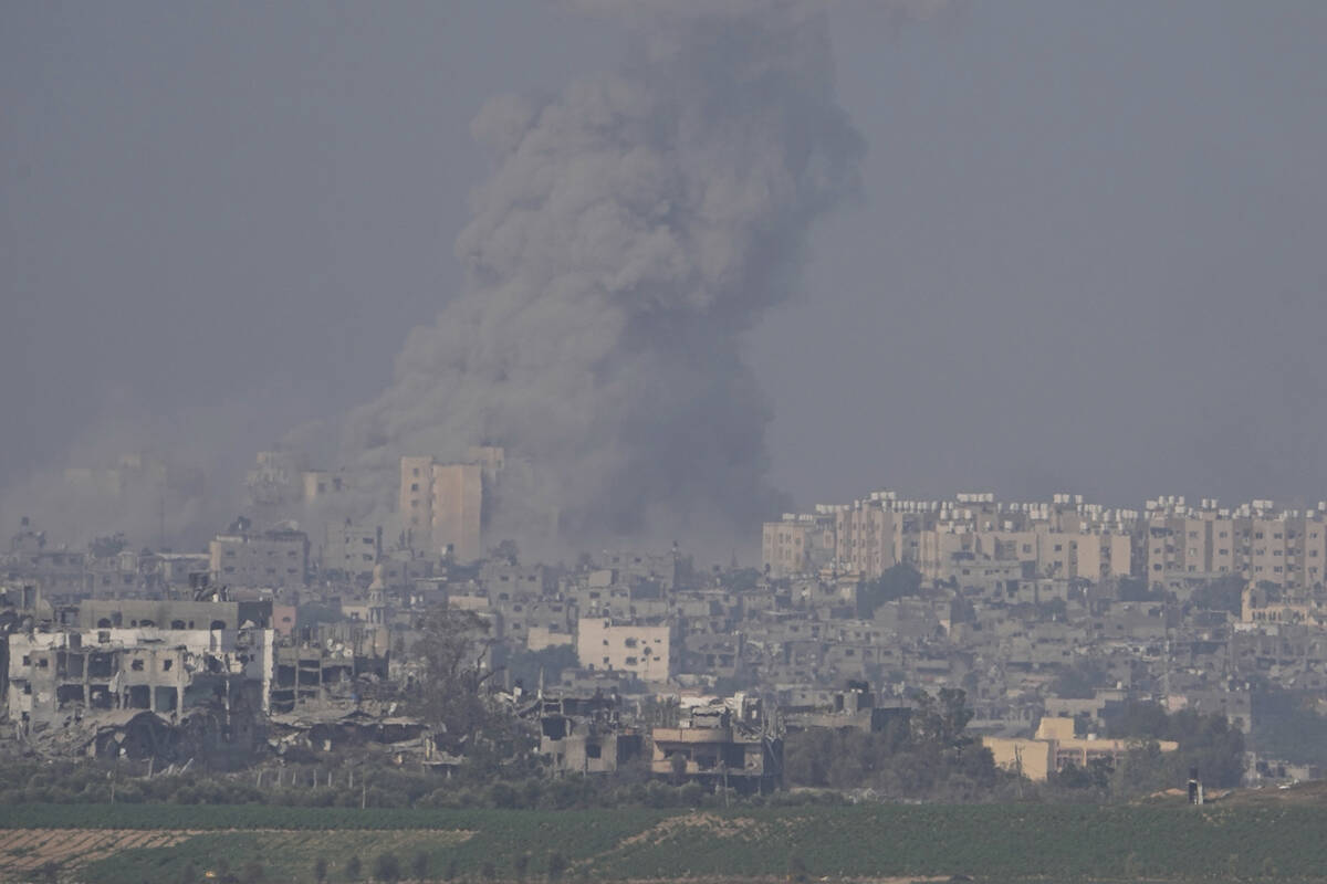 Smoke rises following an Israeli airstrike in the Gaza Strip, as seen from southern Israel, Sat ...