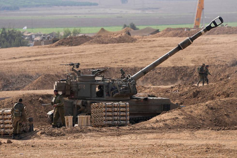 An Israeli mobile artillery unit is seen in a position near the Israel-Gaza border, Israel, Sat ...