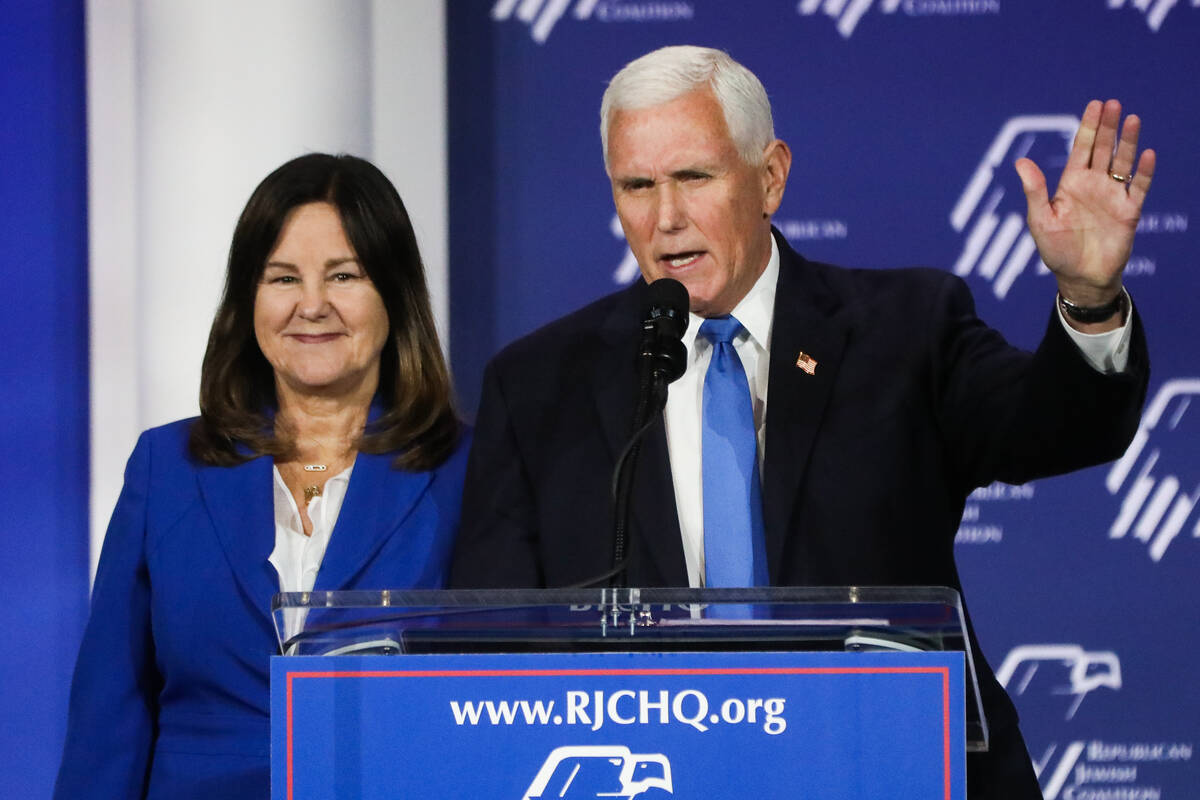 Former Vice President Mike Pence announces the end of his presidential campaign, alongside his ...