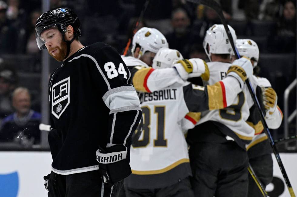 Los Angeles Kings defenseman Vladislav Gavrikov (84) skates by as Vegas Golden Knights celebrat ...