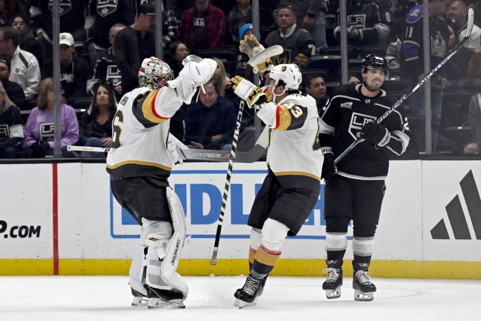 Vegas Golden Knights goaltender Logan Thompson, left, celebrates with center Paul Cotter after ...