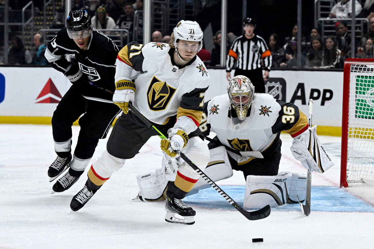 Vegas Golden Knights center William Karlsson (71) clears the puck away from goaltender Logan Th ...