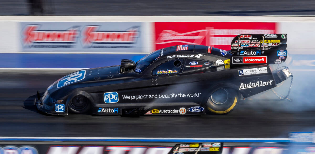 Bob Tasca III races down the track during a Funny Car qualifying session in the NHRA Nevada Nat ...