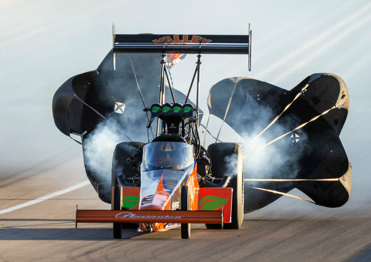 Mike Salinas deploys his parachute during a Top Fuel qualifying session in the NHRA Nevada Nati ...