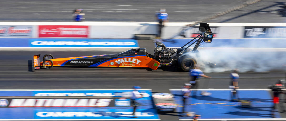 Mike Salinas burns his tires during a Top Fuel qualifying session in the NHRA Nevada Nationals ...