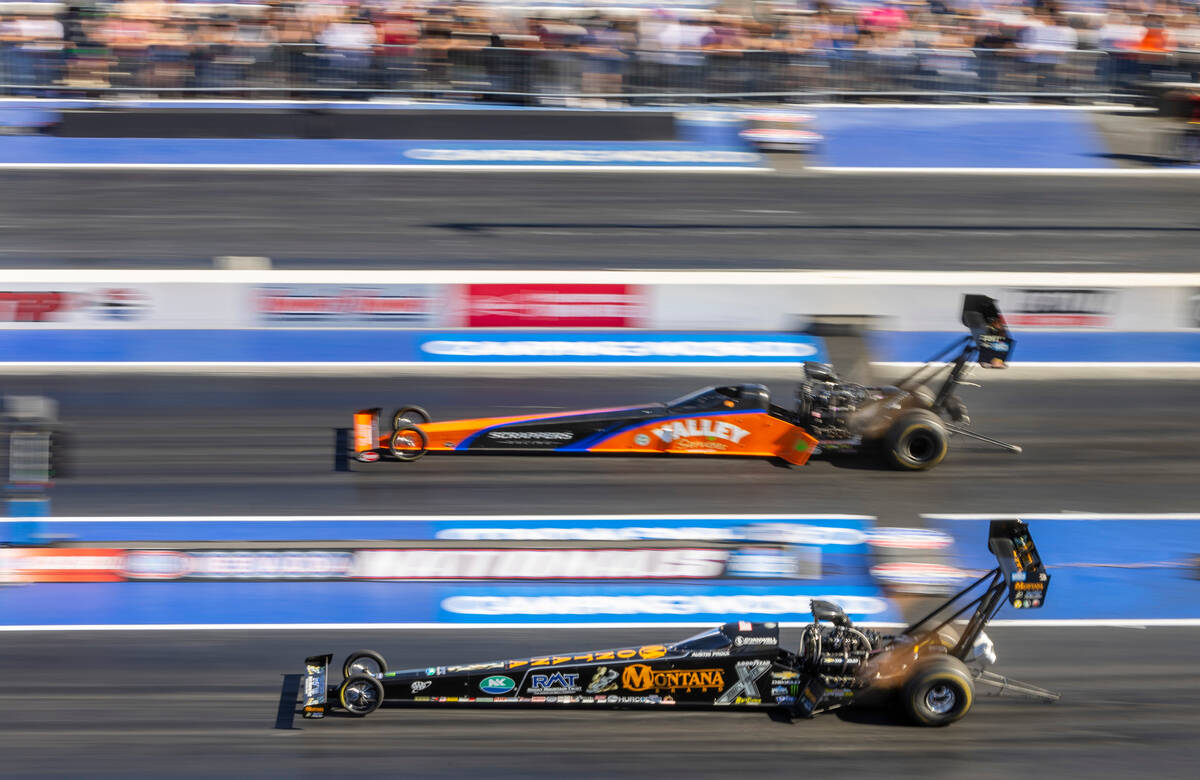 Mike Salinas, top, and Austin Prock battle during a Top Fuel qualifying session in the NHRA Nev ...