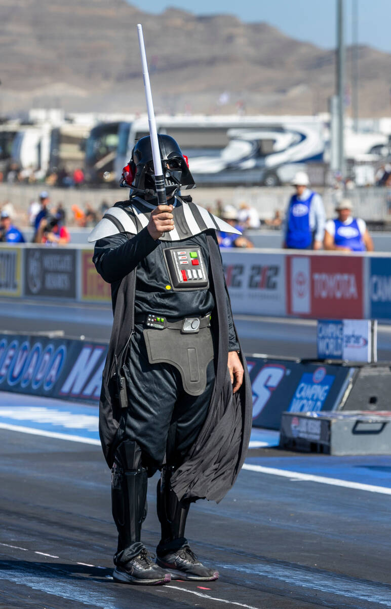 A race team member dresses as Dartth Vader during a qualifying session in the NHRA Nevada Natio ...