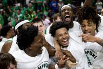 The North Texas Mean Green celebrate after their team won the National Invitation Tournament co ...