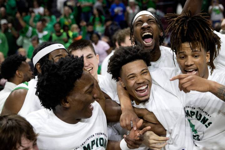 The North Texas Mean Green celebrate after their team won the National Invitation Tournament co ...