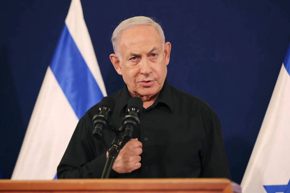 Israeli Prime Minister Benjamin Netanyahu speaks during a press conference with Defense Ministe ...