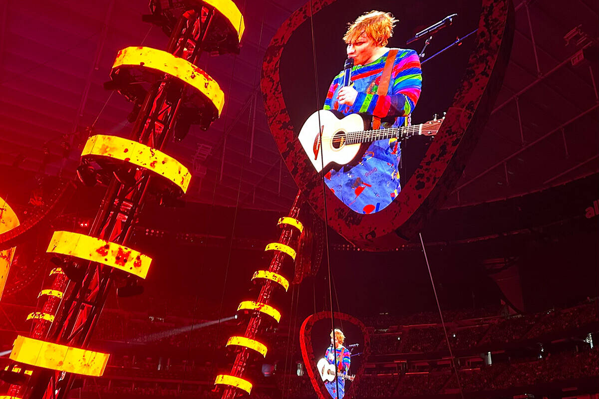 Ed Sheeran, in his Chucky costume for Halloween, is shown at Allegiant Stadium on Saturday, Oct ...