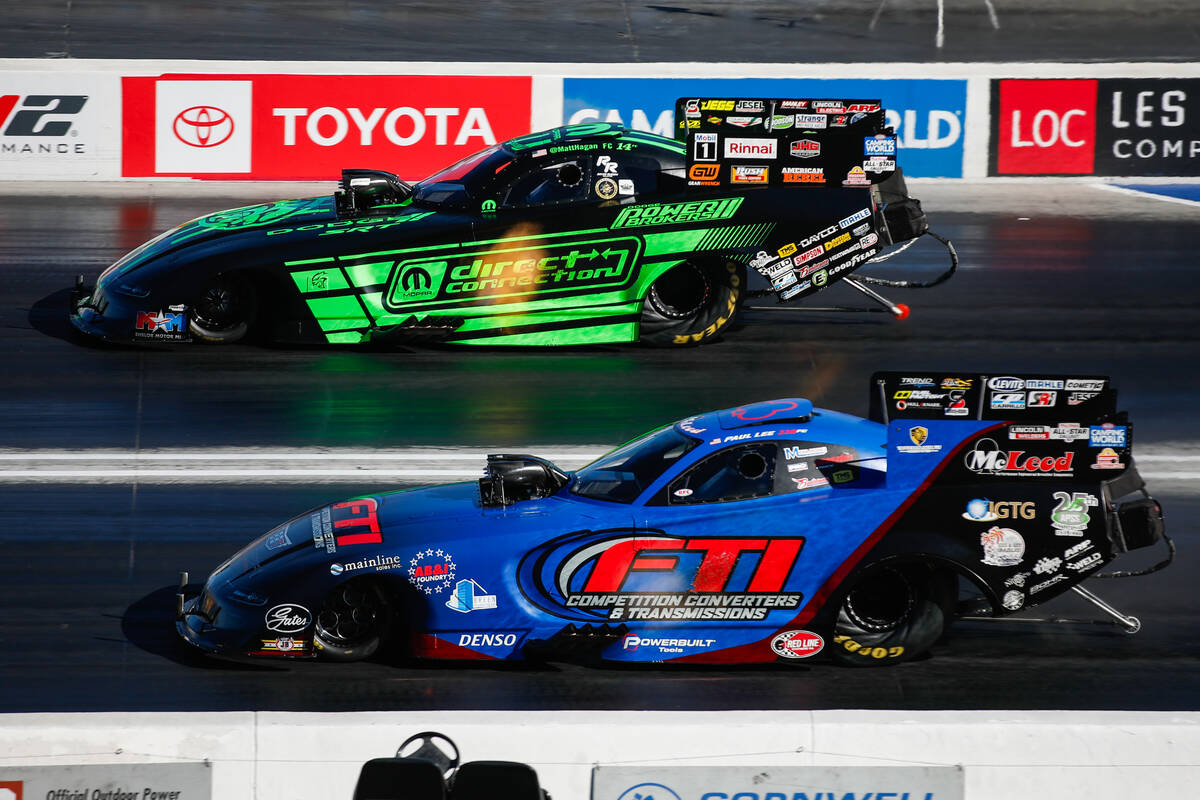 Paul Lee and Matt Hagan go head to head during round 2 of the funny car nitro eliminations at t ...