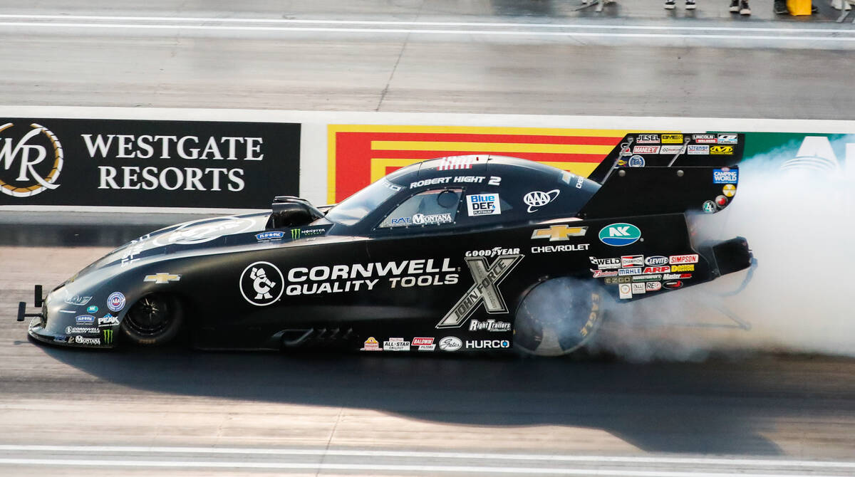 Robert Hight burns out his tires prior to a race at the NHRA Nevada Nationals at The Strip at L ...