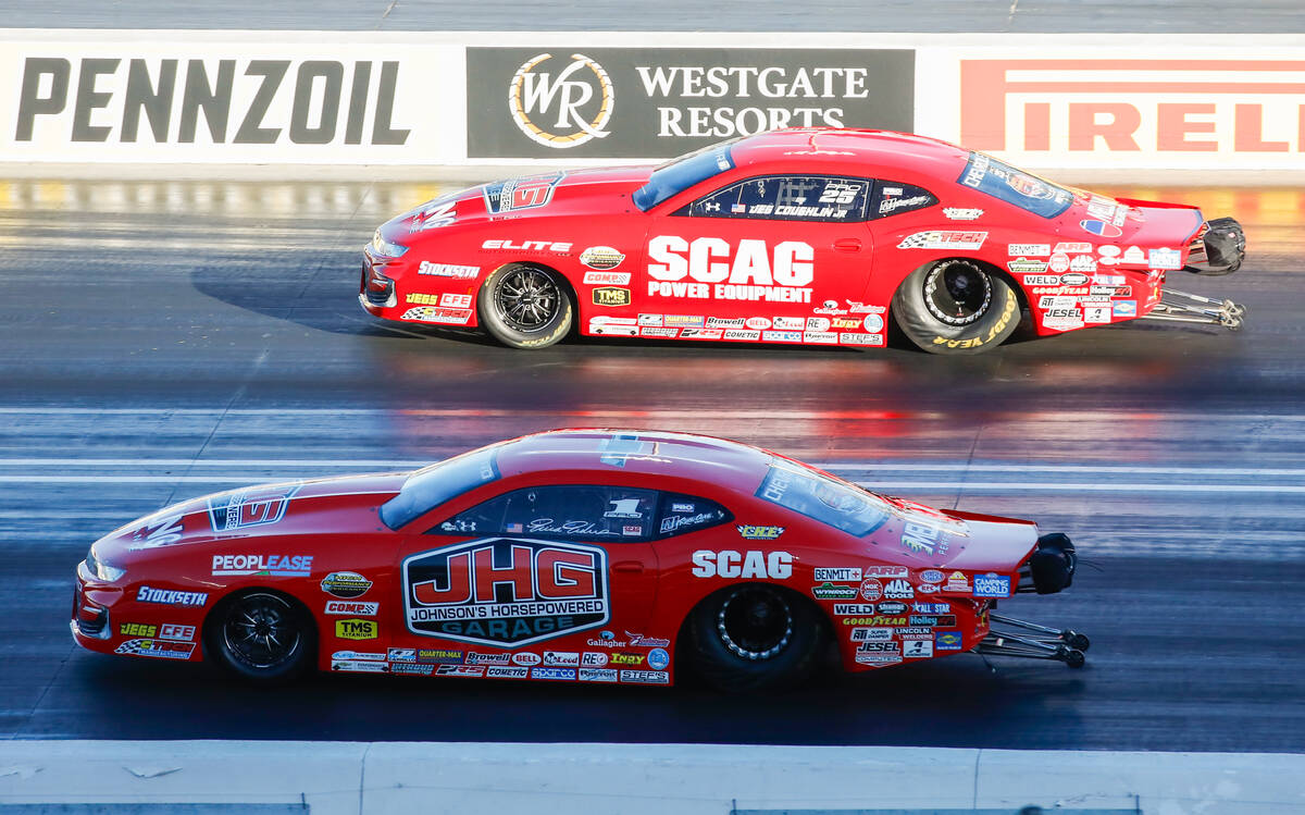 Jeg Coughlin Jr., top, races Erica Enders during the pro stock eliminations semifinals race at ...