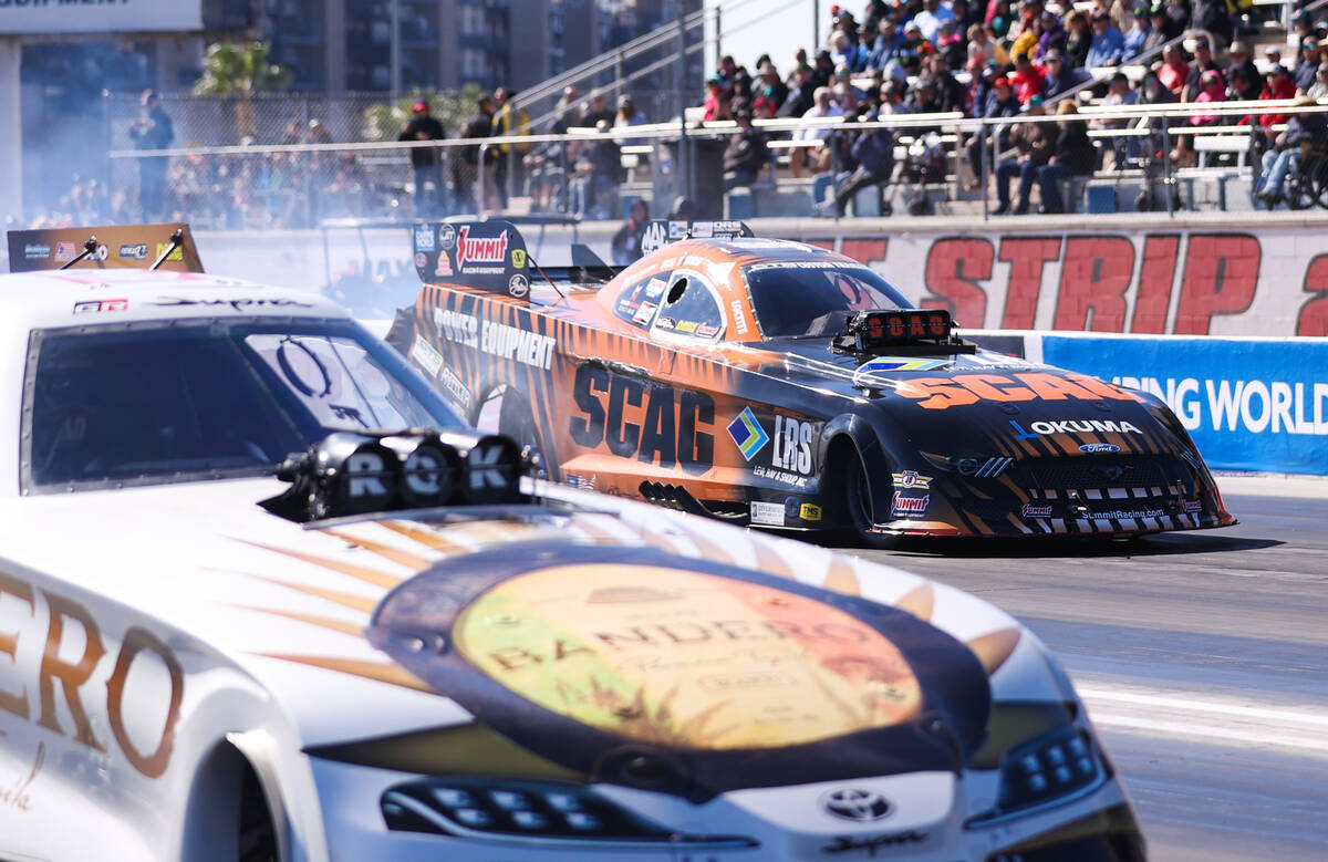 Tim Wilkerson, top, and Alexis DeJoria go head to head at the NHRA Nevada Nationals at The Stri ...