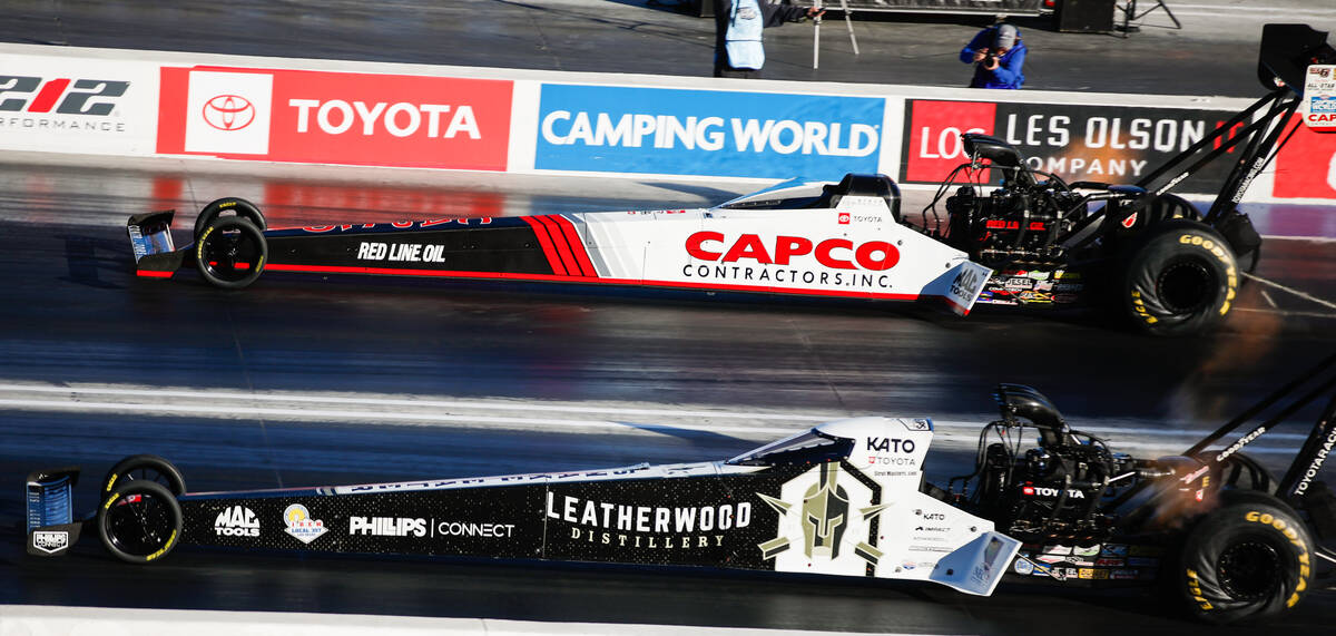 Steve Torrence, top, takes on Justin Ashley during the nitro eliminations top fuel semifinals r ...