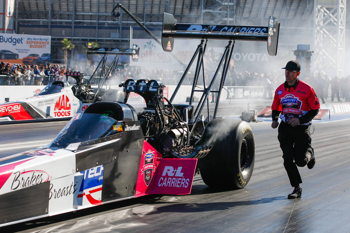 Josh Hart does his burnout prior to round 1 of the funny car nitro eliminations race during the ...
