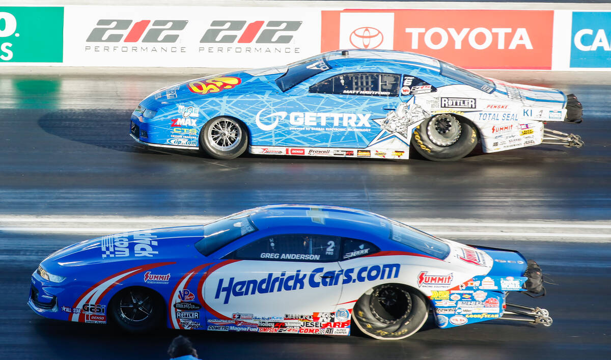 Matt Hartford, top, takes on Greg Anderson during the pro stock eliminations semifinals race at ...