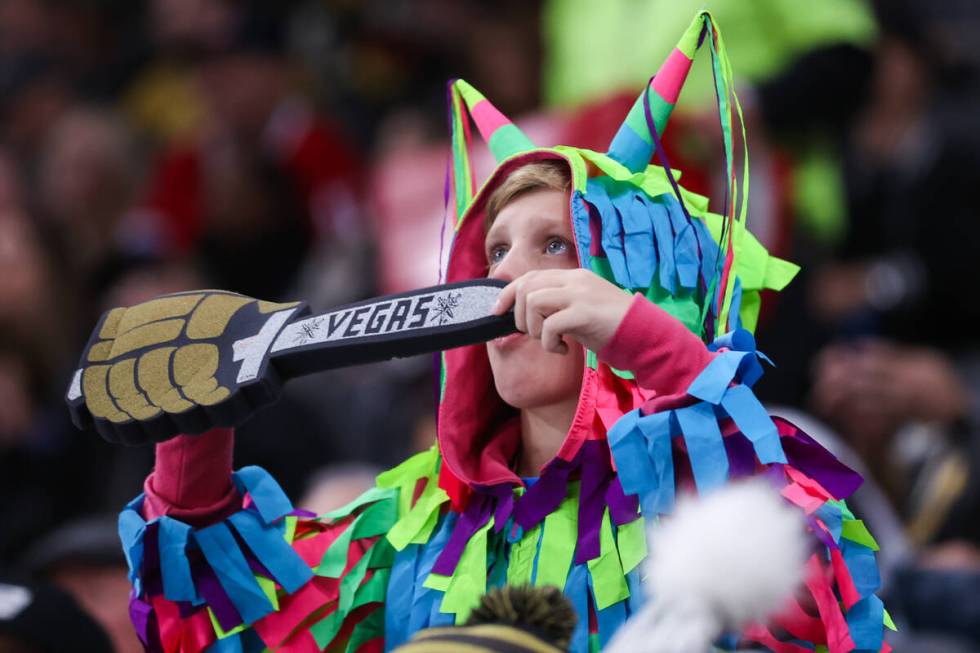 A Golden Knights fan cheers on his team during an NHL game against the Montreal Canadiens at T- ...