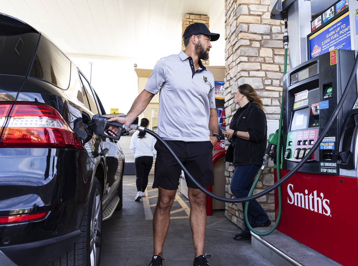 Former Knights defenseman Deryk Engelland pumps free gas for a customer at Smith’s Marketplac ...