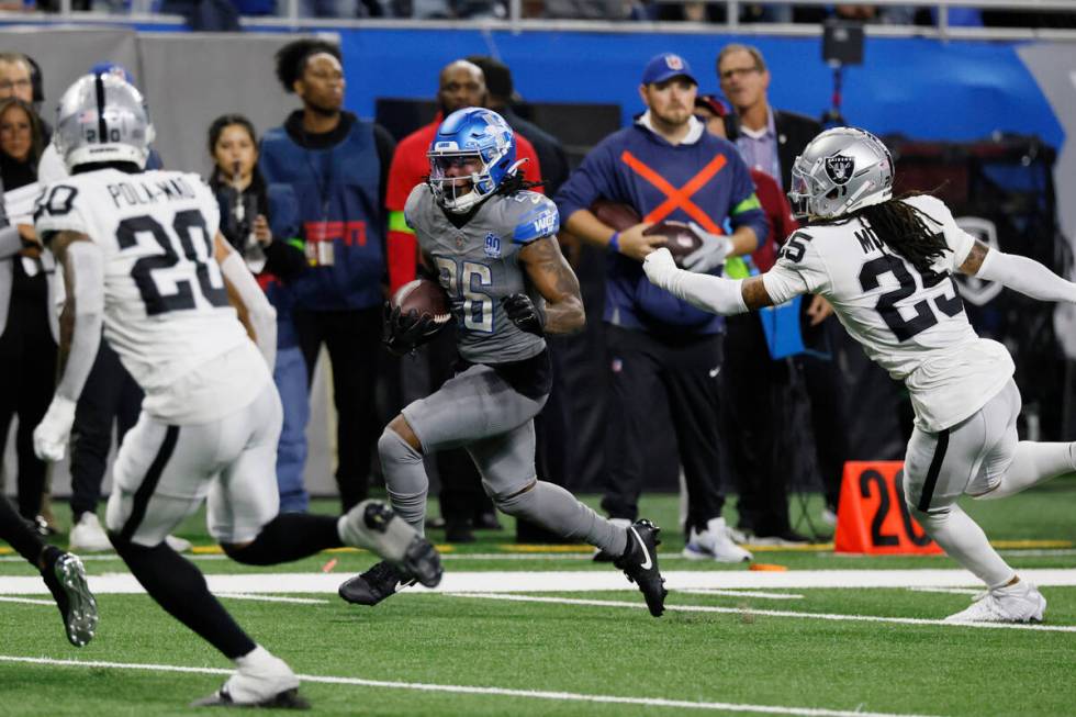 Detroit Lions running back Jahmyr Gibbs (26) rushes during the second half of an NFL football g ...