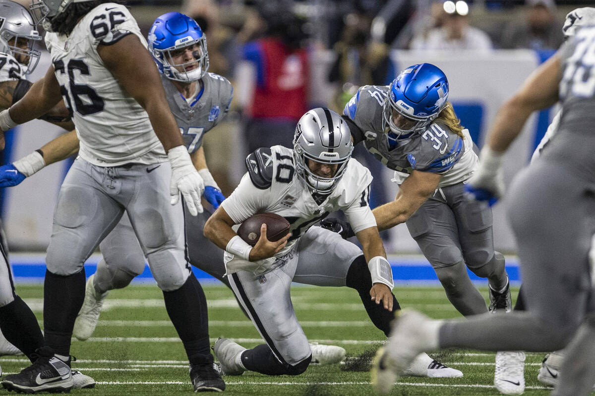 Detroit Lions linebacker Alex Anzalone (34) sacks Raiders quarterback Jimmy Garoppolo (10) duri ...