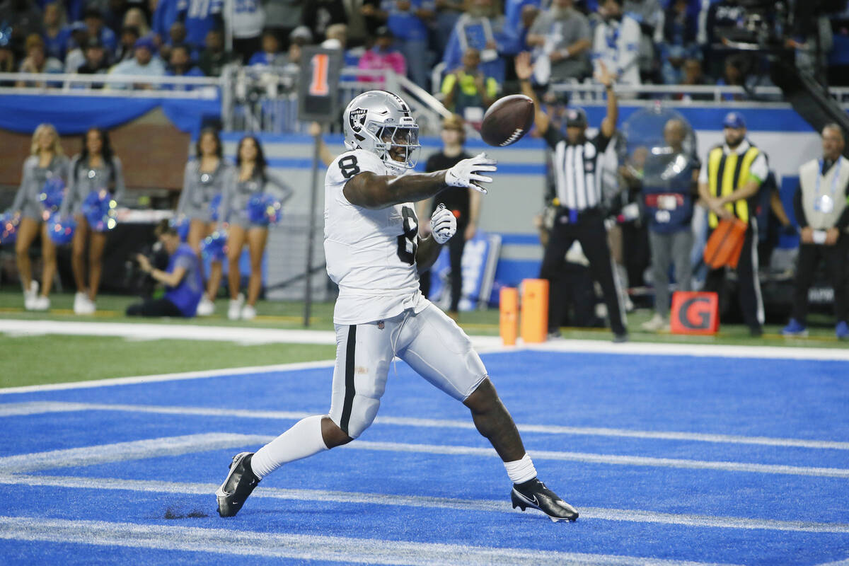 Las Vegas Raiders running back Josh Jacobs (8) throws the ball into the crowd after his three-y ...