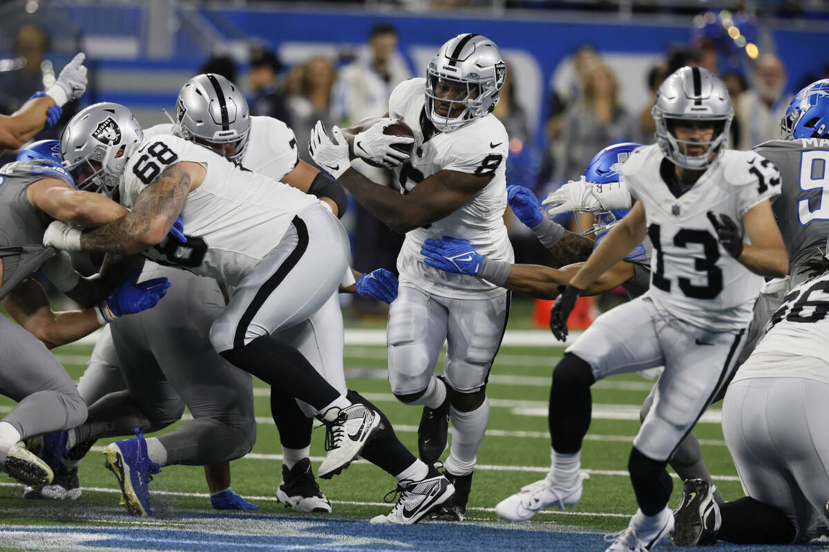 Las Vegas Raiders running back Josh Jacobs (8) rushes during the first half of an NFL football ...