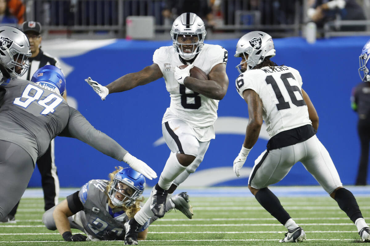 Las Vegas Raiders running back Josh Jacobs (8) rushes against the Detroit Lions in the first ha ...