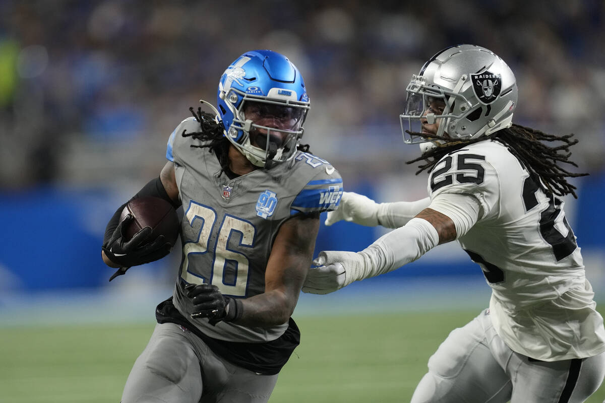 Detroit Lions running back Jahmyr Gibbs (26) rushes against the defense of Las Vegas Raiders sa ...