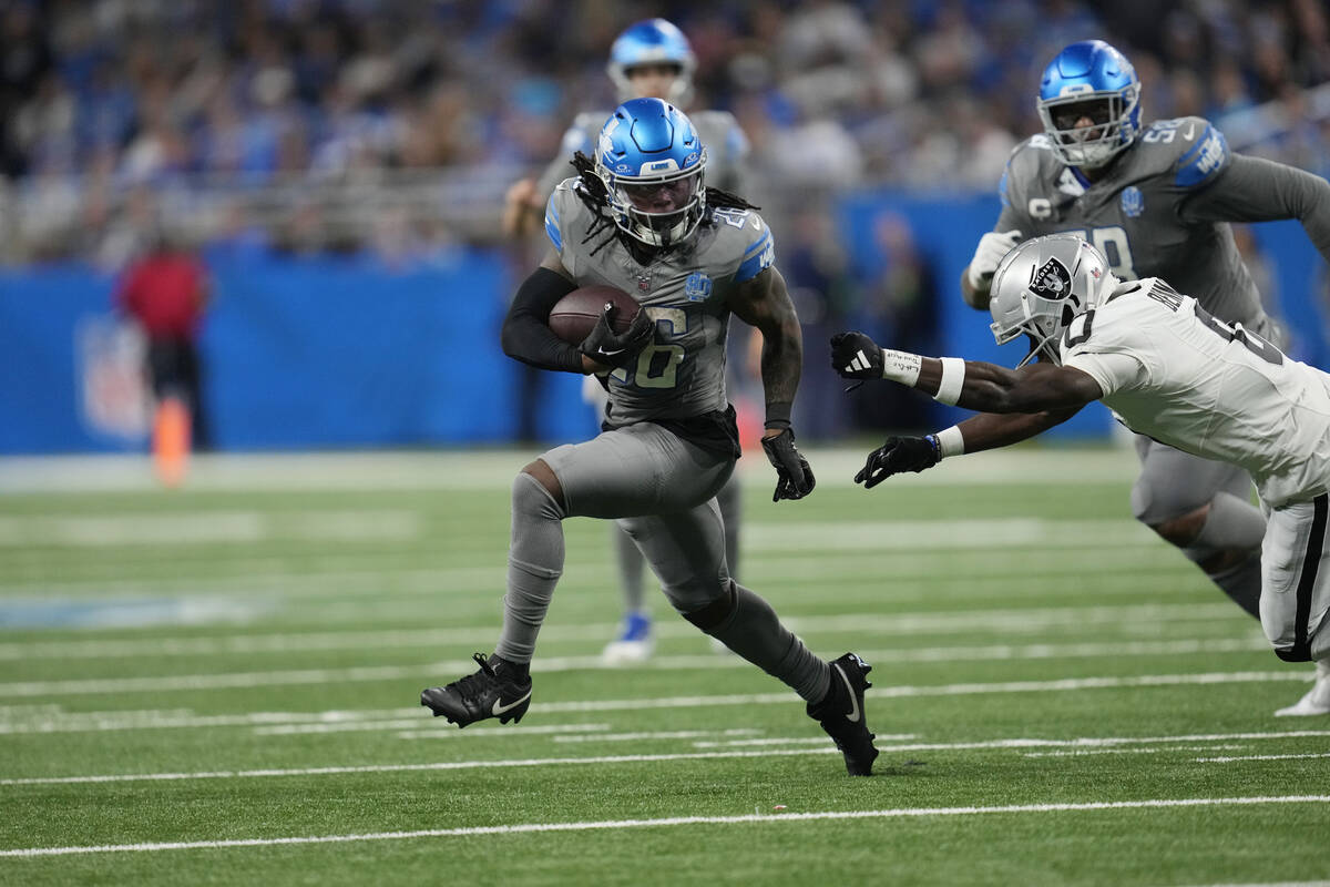 Detroit Lions running back Jahmyr Gibbs rushes during the second half of an NFL football game a ...