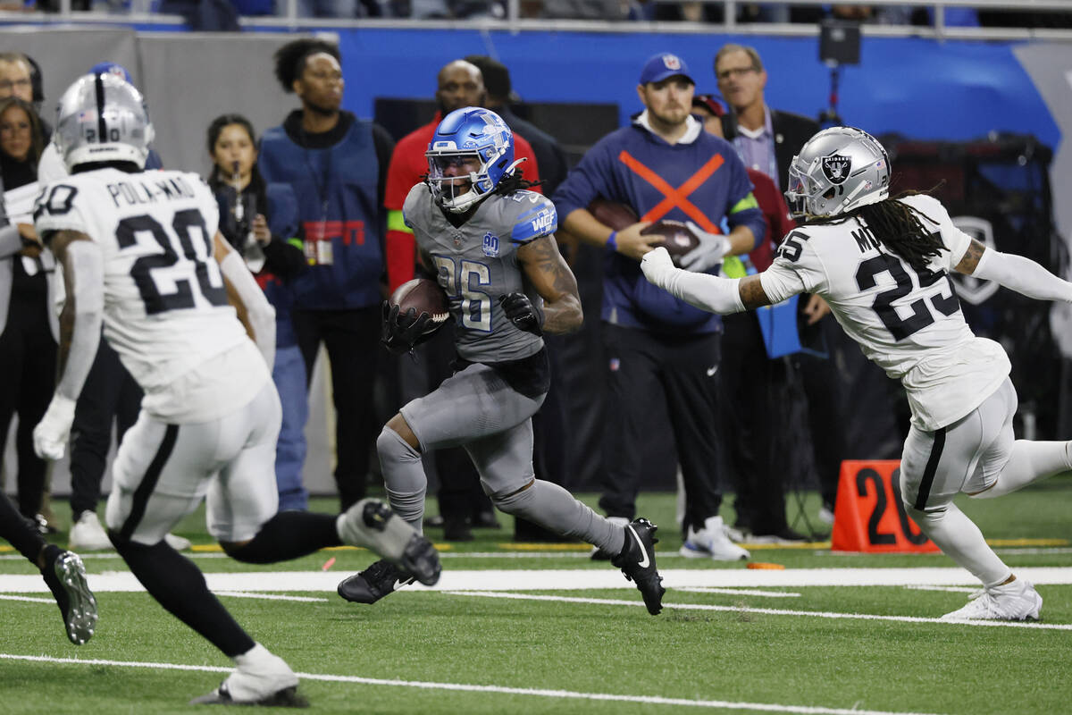 Detroit Lions running back Jahmyr Gibbs (26) rushes during the second half of an NFL football g ...