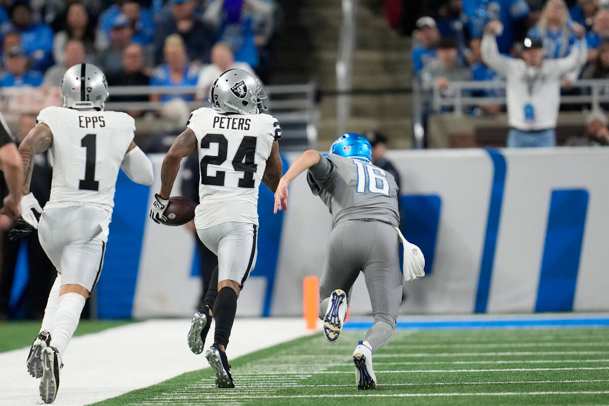 Las Vegas Raiders cornerback Marcus Peters (24) returns an intercepted pass from Detroit Lions ...