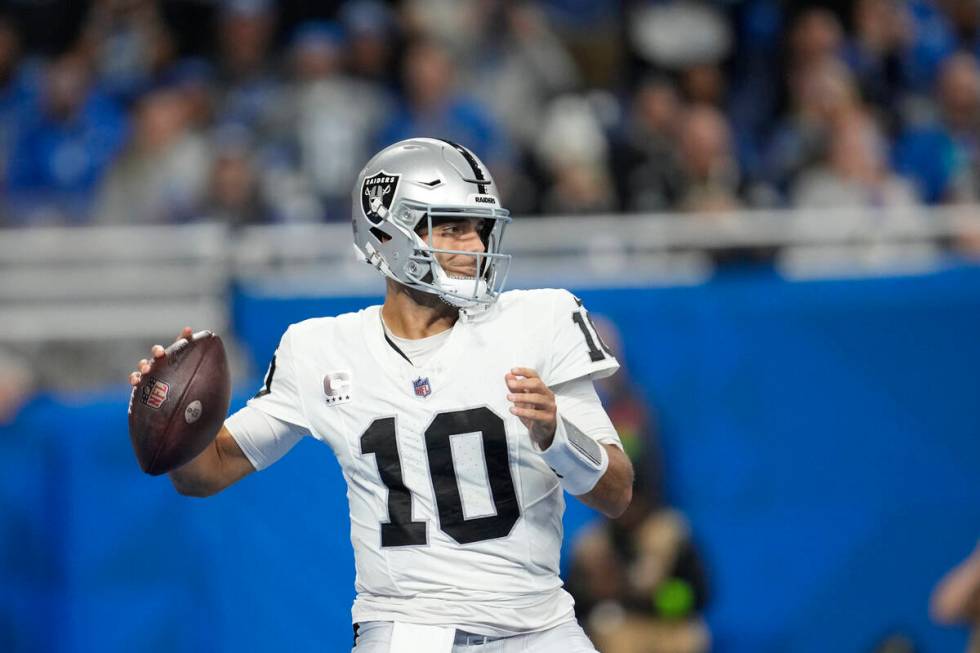 Las Vegas Raiders quarterback Jimmy Garoppolo throws during the second half of an NFL football ...