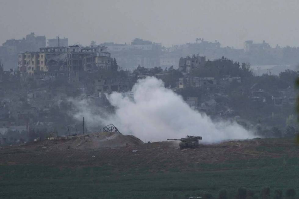 Israeli tanks take position along the Israeli border with the Gaza Strip, as seen from southern ...