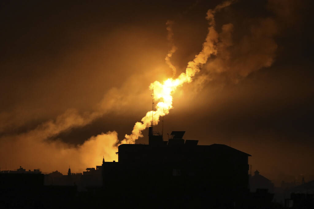 Israeli forces' flares light up the night sky in northern Gaza Strip, Tuesday, Oct. 31, 2023. ( ...