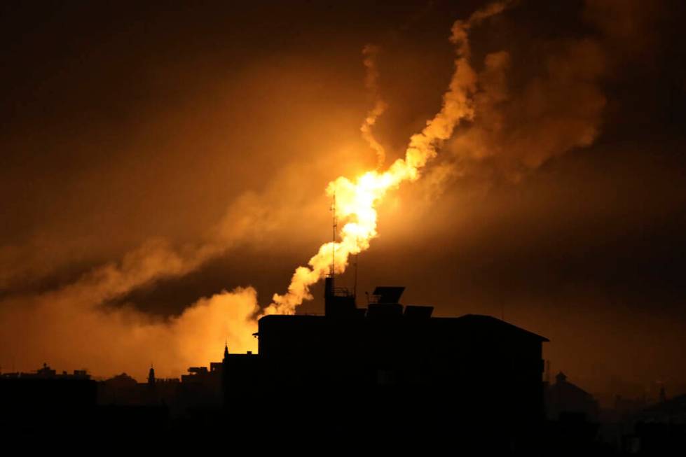 Israeli forces' flares light up the night sky in northern Gaza Strip, Tuesday, Oct. 31, 2023. ( ...