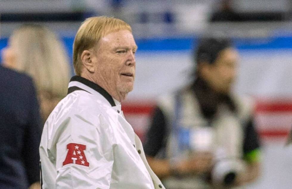 Raiders owner Mark Davis watches team warm ups from the sideline before an NFL game between the ...