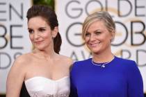FILE - In this Jan. 11, 2015, file photo, Tina Fey, left, and Amy Poehler arrive at the 72nd an ...