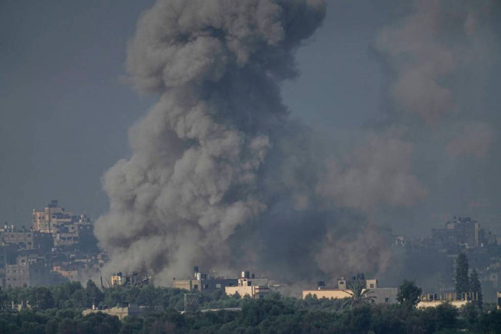 Smoke rises following an Israeli airstrike in the Gaza Strip, as seen from southern Israel, Wed ...