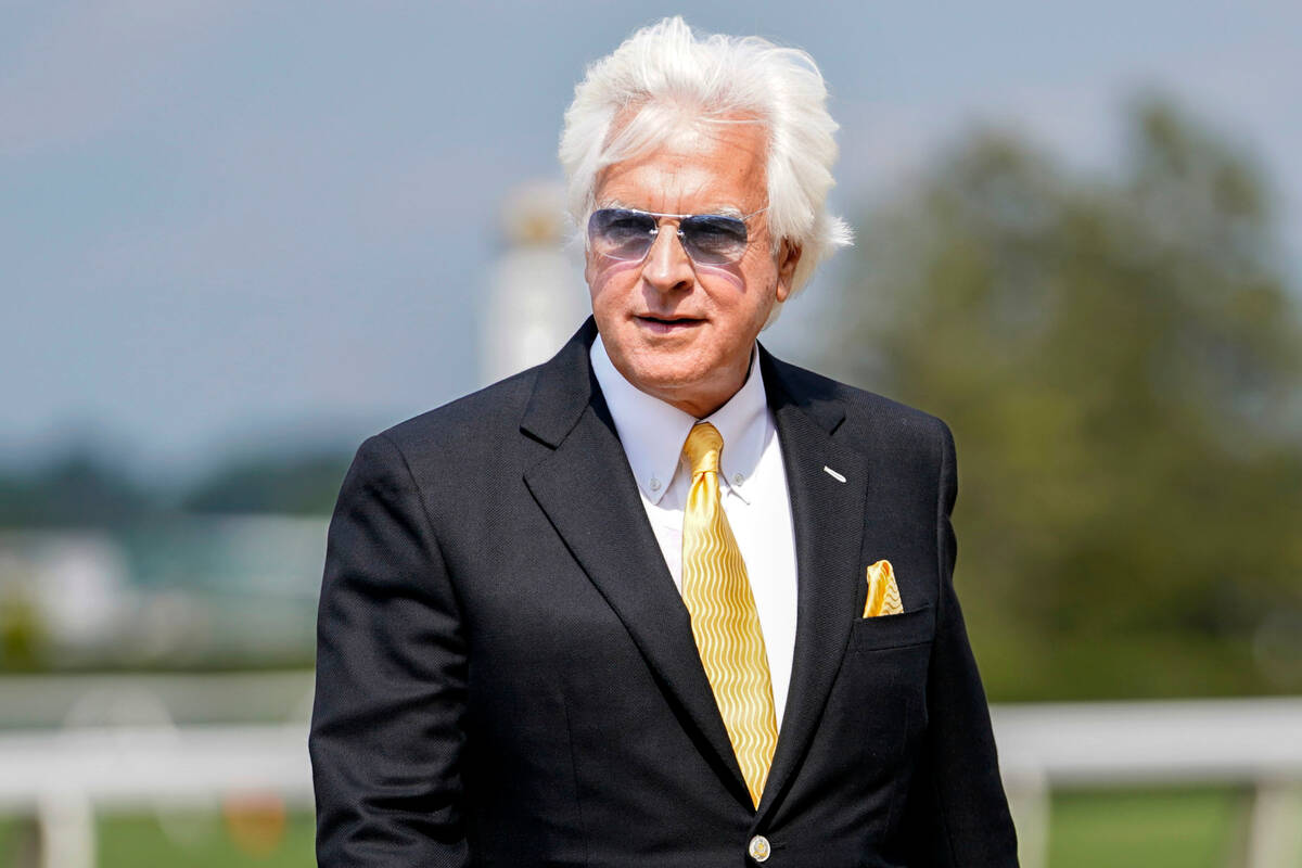 FILE - Trainer Bob Baffert walks off the track after his horse Arabian Lion won The Woody Step ...